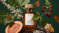 Schön eau de parfum bottle among blackberries, oak leaves, lichen and amber resin